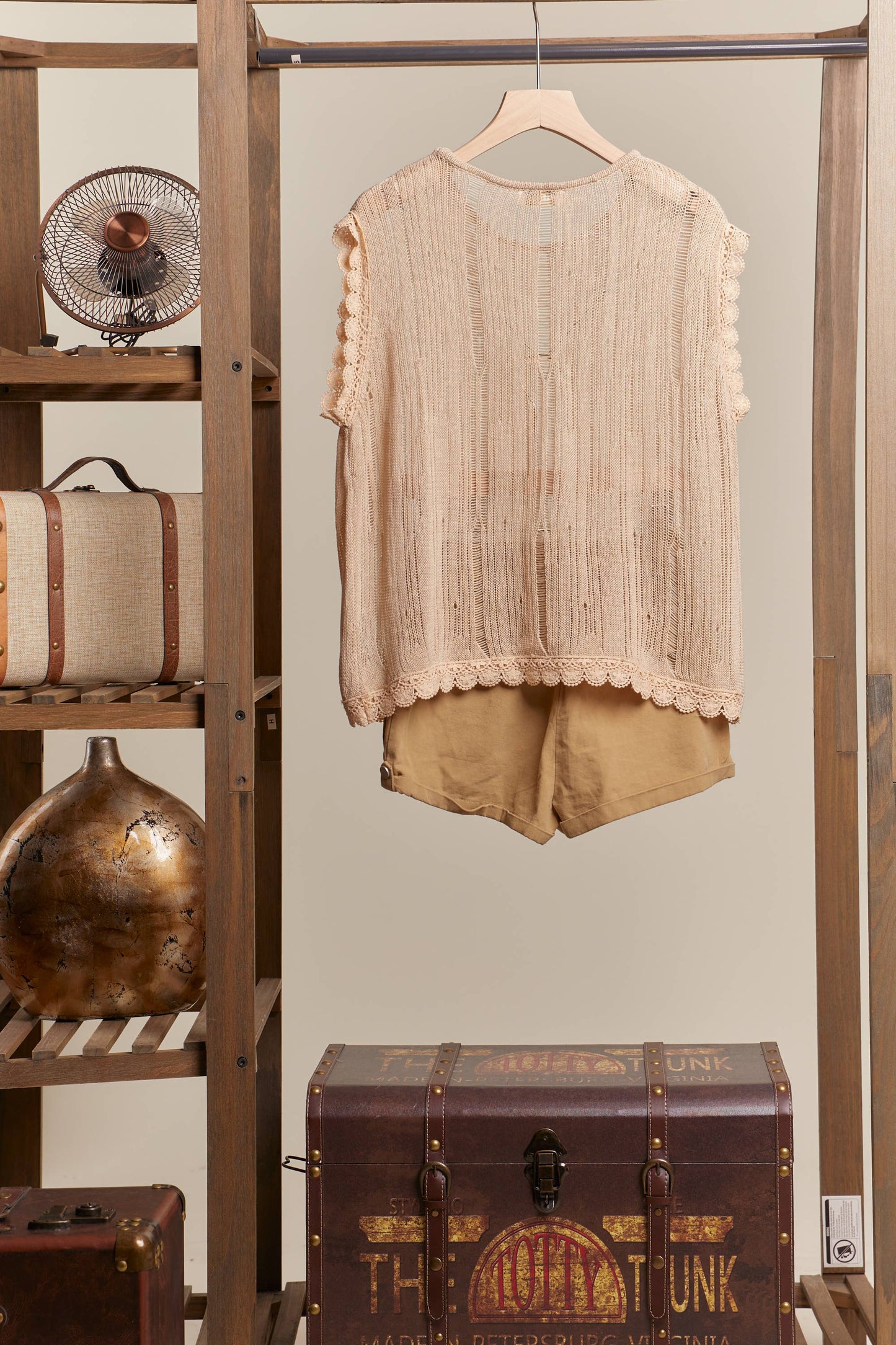 Boat Neck Sleeveless Top with Lace Hem Mello.