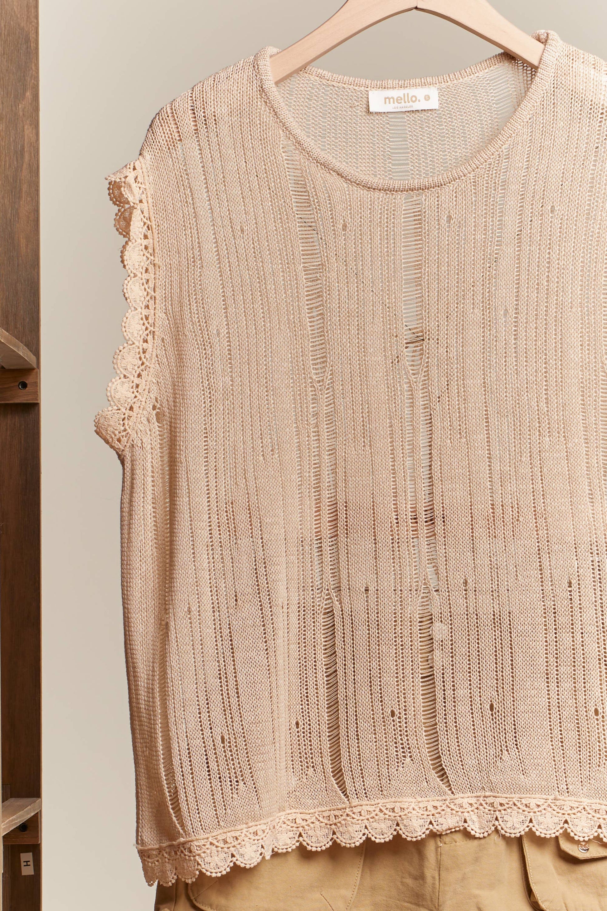 Boat Neck Sleeveless Top with Lace Hem Mello.